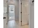 Clean hallway with tile flooring and doors leading to other rooms at 2584 89Th Street E Cir, Palmetto, FL 34221