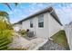 Side view of the house with AC unit and landscaping at 2584 89Th Street E Cir, Palmetto, FL 34221