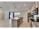 Open concept kitchen with island and stainless steel appliances at 2584 89Th Street E Cir, Palmetto, FL 34221