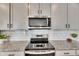 Modern kitchen with stainless steel appliances and white subway tile at 2584 89Th Street E Cir, Palmetto, FL 34221