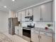 Modern kitchen with stainless steel appliances and granite countertops at 2584 89Th Street E Cir, Palmetto, FL 34221
