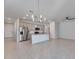 Open concept kitchen with island and stainless steel appliances at 2584 89Th Street E Cir, Palmetto, FL 34221