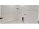 Bright laundry room with built-in shelving and tile floor at 2584 89Th Street E Cir, Palmetto, FL 34221