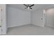 Spacious living room with ceiling fan and neutral color palette at 2584 89Th Street E Cir, Palmetto, FL 34221