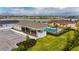 Aerial view of community pool with cabana and lounge chairs at 2584 89Th Street E Cir, Palmetto, FL 34221