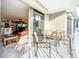 Private balcony with outdoor furniture and living room view at 2611 Bayshore Blvd # 302, Tampa, FL 33629