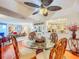 Bright dining room features a glass-top table with carved chairs, and a view into the kitchen at 2611 Bayshore Blvd # 302, Tampa, FL 33629
