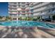 Community pool and building exterior view at 2611 Bayshore Blvd # 302, Tampa, FL 33629