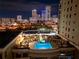 Inviting rooftop pool at night with city skyline view at 275 Bayshore Blvd # 1702, Tampa, FL 33606