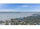 Expansive aerial view showcases waterfront community, featuring boat dotted harbor and distant city skyline at 2812 Miriam S St, Gulfport, FL 33711