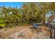 Backyard with a brick patio, leafy vegetation, and a barbecue grill at 2812 Miriam S St, Gulfport, FL 33711