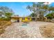 Front view of a yellow house with a spacious driveway at 2812 Miriam S St, Gulfport, FL 33711