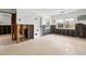 Spacious living room with terrazzo floors and walls undergoing renovation at 2812 Miriam S St, Gulfport, FL 33711