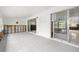 Open concept living room with a tiled floor, walls under renovation, and sliding glass doors at 2812 Miriam S St, Gulfport, FL 33711
