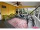 Relaxing screened porch with seating and bicycles at 2812 Miriam S St, Gulfport, FL 33711