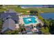 Aerial view of a resort-style pool with a fountain and ample lounge seating for relaxing and soaking up the sun at 29330 Schinnecock Hills Ln, San Antonio, FL 33576