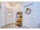 Bright entryway with white doors, chandelier, and decorative shelving at 29330 Schinnecock Hills Ln, San Antonio, FL 33576