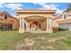 Covered entryway to large estate with columns and attached garage at 309 Pruett Rd, Seffner, FL 33584