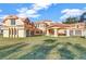 Grand estate with covered entryway, multiple garages, and manicured lawn at 309 Pruett Rd, Seffner, FL 33584