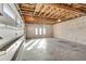 Unfinished garage with high ceilings and large garage doors, currently under construction at 309 Pruett Rd, Seffner, FL 33584