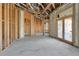 Interior of a house under construction with exposed framing and high ceilings at 309 Pruett Rd, Seffner, FL 33584