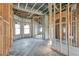 Interior of house under construction, with exposed beams and framing at 309 Pruett Rd, Seffner, FL 33584