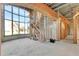 Unfinished interior with staircase and large windows at 309 Pruett Rd, Seffner, FL 33584