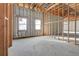 Unfinished room with high ceilings and large windows, currently under construction at 309 Pruett Rd, Seffner, FL 33584