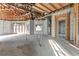 Spacious interior with high ceilings and large windows, currently under construction at 309 Pruett Rd, Seffner, FL 33584