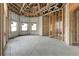 Interior of a house under construction with large windows and exposed framing at 309 Pruett Rd, Seffner, FL 33584