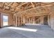 Upper-level bedroom framing, showing the unfinished room's structure and windows at 309 Pruett Rd, Seffner, FL 33584