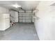 Garage with concrete floor and shelving at 3148 Harvardston Loop, Holiday, FL 34691
