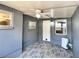 Laundry area with gray walls, wood-look floors, and windows at 3148 Harvardston Loop, Holiday, FL 34691