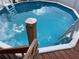 Above-ground pool with wooden deck and ladder at 3148 Harvardston Loop, Holiday, FL 34691