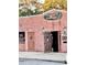 Little Corona's Cigar Lounge, a brick building with rustic doors at 3148 Harvardston Loop, Holiday, FL 34691