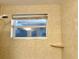 Shower stall with beige tile and a small shelf at 3148 Harvardston Loop, Holiday, FL 34691