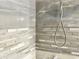 Shower with gray and white mosaic tile at 3148 Harvardston Loop, Holiday, FL 34691