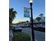 Vibrant street scene in Newport Richey, showcasing shops and parked cars at 3148 Harvardston Loop, Holiday, FL 34691