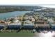Aerial view of waterfront community with boat slips at 318 Windrush Blvd # 10, Indian Rocks Beach, FL 33785