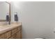 Small bathroom with light wood vanity at 318 Windrush Blvd # 10, Indian Rocks Beach, FL 33785