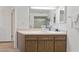Bathroom with vanity and wood cabinets at 318 Windrush Blvd # 10, Indian Rocks Beach, FL 33785
