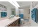 Bathroom features a tub, shower, vanity, and plenty of storage at 318 Windrush Blvd # 10, Indian Rocks Beach, FL 33785