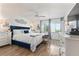 Spacious main bedroom with a king-size bed and white dresser at 318 Windrush Blvd # 10, Indian Rocks Beach, FL 33785