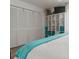 Bedroom with white closet doors and teal bedding at 318 Windrush Blvd # 10, Indian Rocks Beach, FL 33785