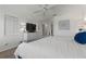 Main bedroom with king bed, dresser, and TV at 318 Windrush Blvd # 10, Indian Rocks Beach, FL 33785