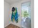 Bright condo entryway with beach-themed decor at 318 Windrush Blvd # 10, Indian Rocks Beach, FL 33785