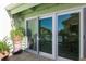 Sliding glass doors leading to a balcony with pool view at 318 Windrush Blvd # 10, Indian Rocks Beach, FL 33785