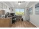 Home office with wood desk and hardwood floors at 318 Windrush Blvd # 10, Indian Rocks Beach, FL 33785