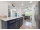 Kitchen with island, open to office and living areas at 318 Windrush Blvd # 10, Indian Rocks Beach, FL 33785