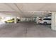 Covered parking garage with several parking spots available at 318 Windrush Blvd # 10, Indian Rocks Beach, FL 33785